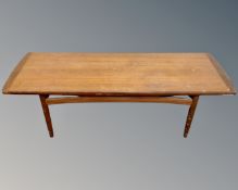 A mid-20th century teak refectory coffee table (width 135cm)
