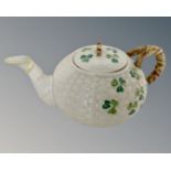 A Belleek porcelain teapot.