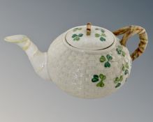 A Belleek porcelain teapot.