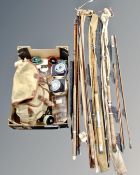 A box containing Brady fishing bag, assorted accessories including reels, fishing flies,