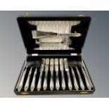 A canteen of silver fish cutlery, six place setting with serving knife and fork,