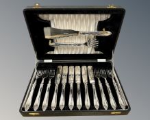 A canteen of silver fish cutlery, six place setting with serving knife and fork,