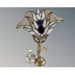 A contemporary Art Deco style figural table lamp together with a flower fairy glass perfume bottle