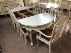 A continental white and gilt oval dining table length 158 cm (no leaves) together with a set of ten