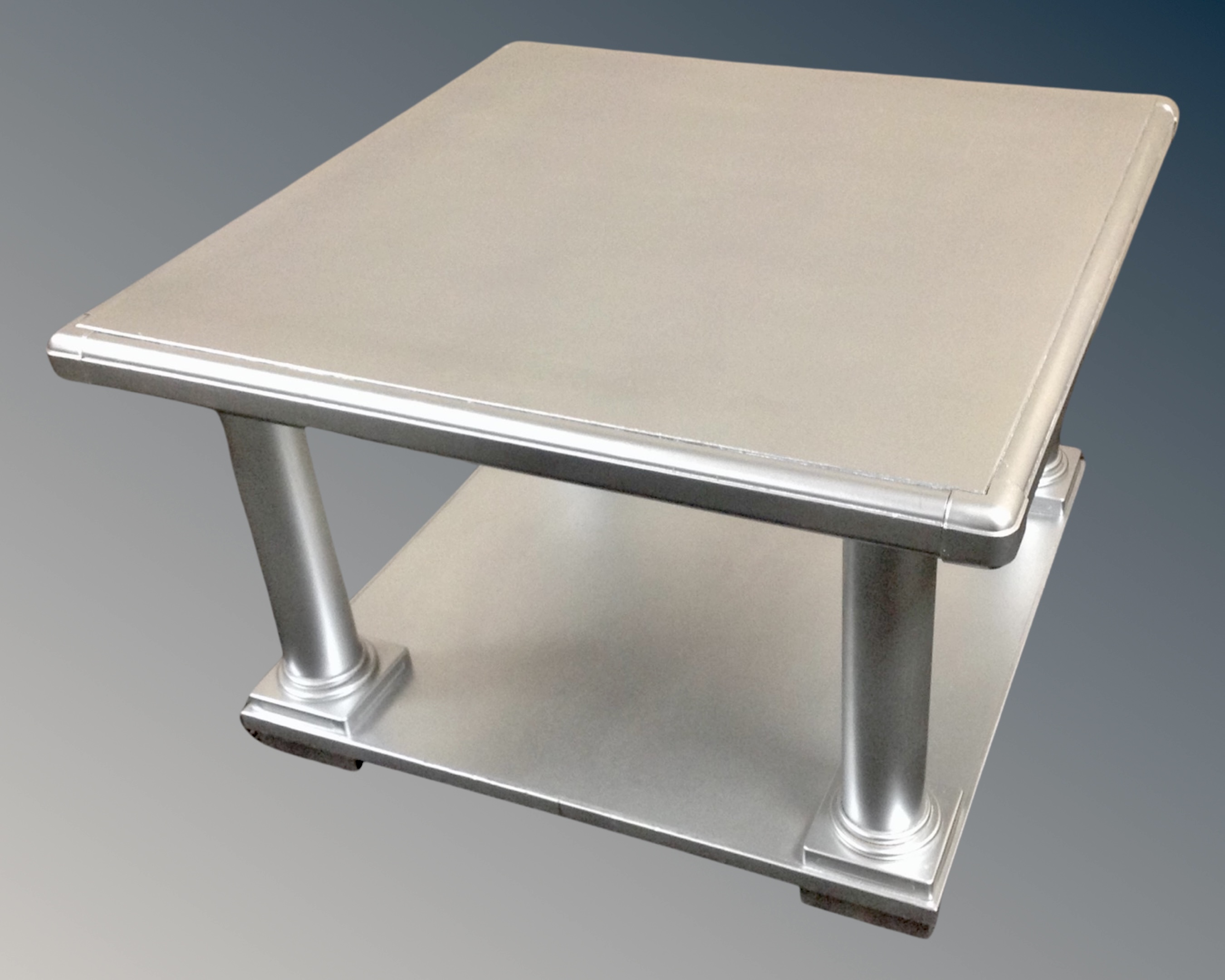 A contemporary two tier square coffee table in a silver finish (width 61cm)