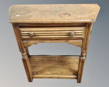 A 20th century shaped hall table fitted with a drawer and undershelf.