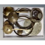 A tray containing antique and later clock pendulums including brass examples,