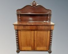A Victorian mahogany double door chiffoniere with barley twist column supports.