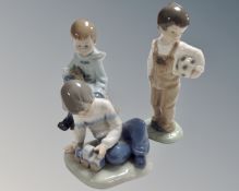Three Nao figures, Boy with Rabbit, Boy with Train and Boy with Football.