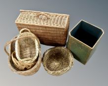 A quantity of wicker baskets together with a bin in the form of a leather bound book.