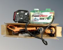 A boxed Cuprinol power sprayer, a Lawnmaster strimmer and a compressor.