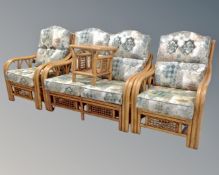 A four piece bamboo and wicker conservatory suite comprising of two settees,