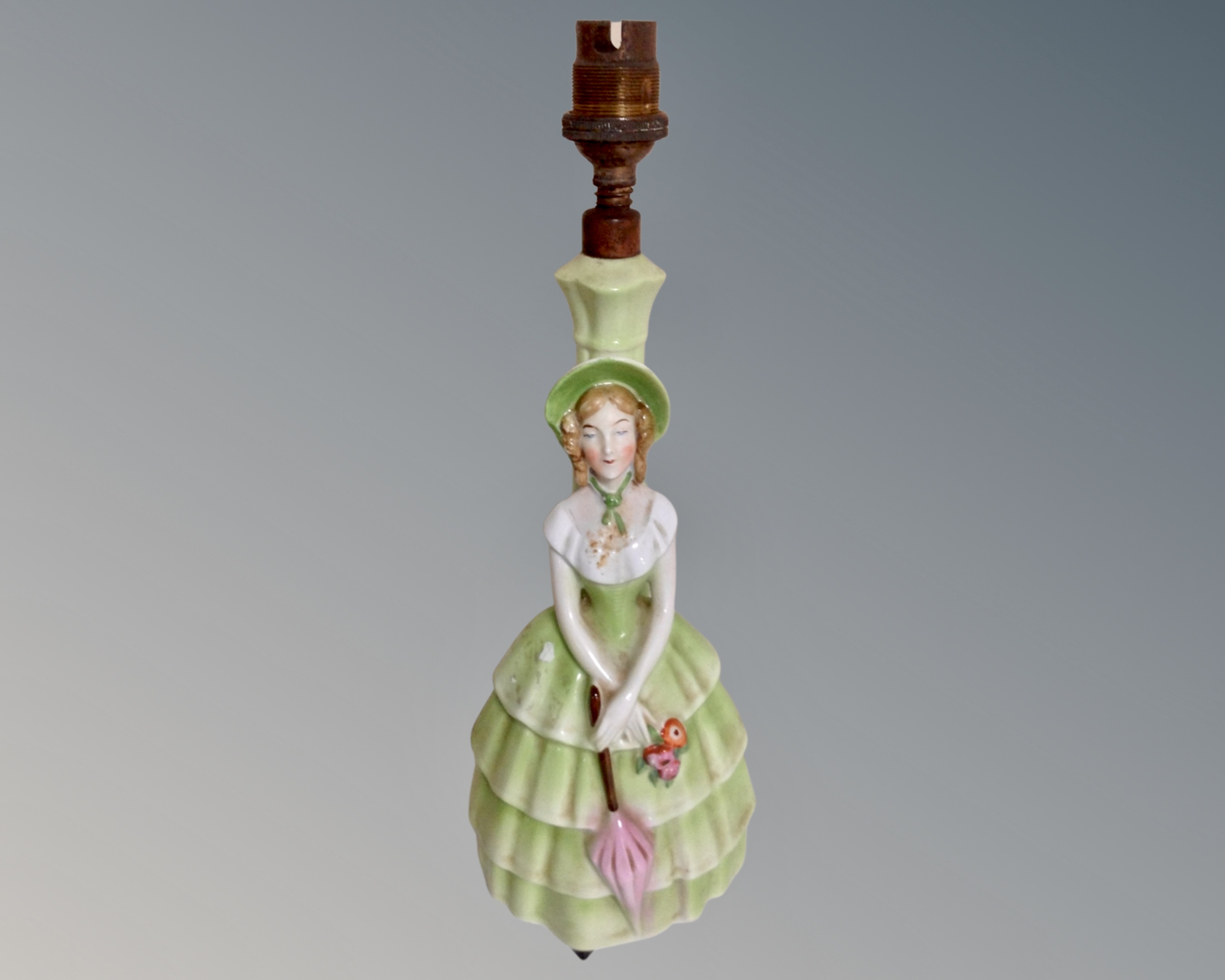 A Continental figural porcelain lamp base (height 29cm) CONDITION REPORT: Not wired.