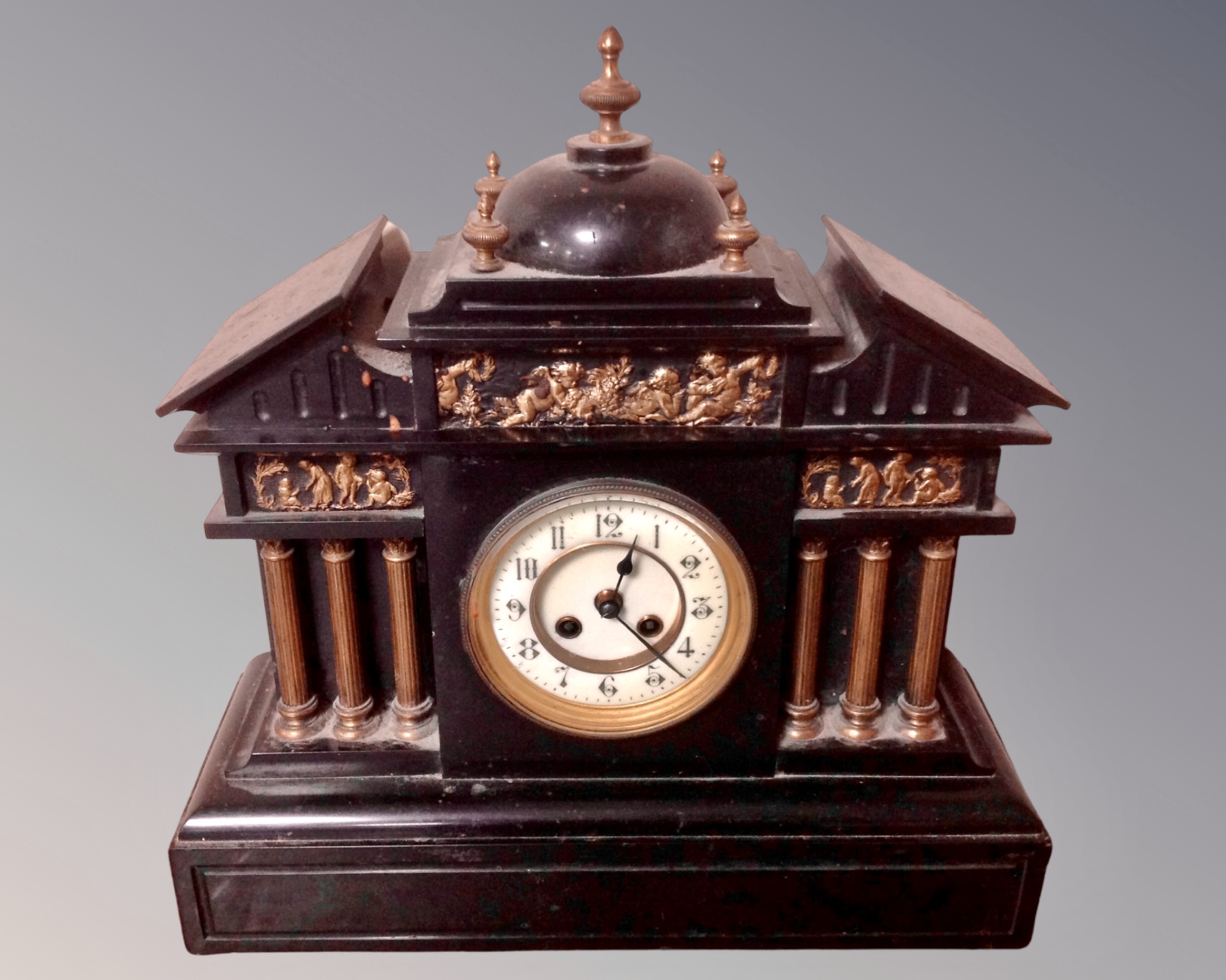A Victorian slate and gilt metal mantel clock.