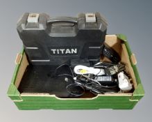 A cased Titan electric hammer drill, a digital set top box, leads,