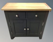 A contemporary double door cabinet fitted with two drawers and oak top (width 75cm)