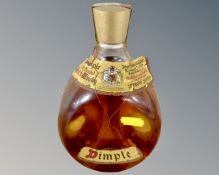 A vintage bottle of Dimple Old Blended Scotch Whisky 70% proof