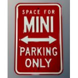 A reproduction metal parking sign.