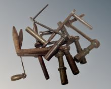 A bag containing nine brass and steel longcase clock crank keys.