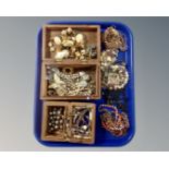 Two Eastern carved trinket boxes together with a collection of costume jewellery.