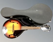 An Antoria mandolin in hard carry case.