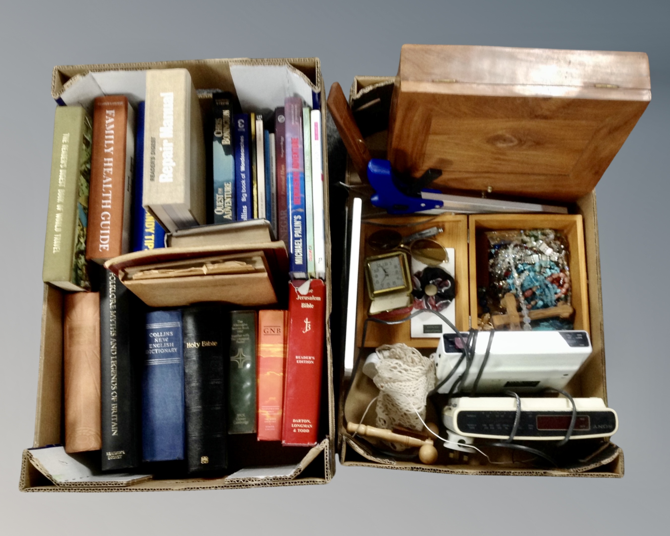 Two boxes of books, costume jewellery, travel clock, alarm clocks,