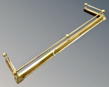 A 19th century brass telescopic fire curb