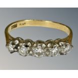 An 18ct gold five stone diamond ring, size K½, 2.5g.