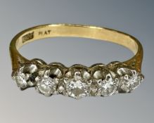 An 18ct gold five stone diamond ring, size K½, 2.5g.