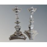 A pair of chromed candelabra.