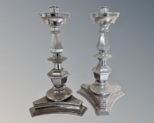 A pair of chromed candelabra.