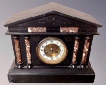 A Victorian slate and marble mantel clock.