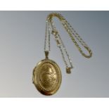 A 9ct yellow gold locket suspended on 9ct fine chain, 6.7g.