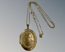 A 9ct yellow gold locket suspended on 9ct fine chain, 6.7g.