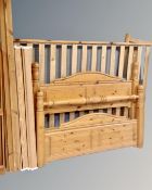 A pine 4'6" bed frame together with a further part pine bed frame.