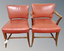 A mid-20th century beech framed armchair upholstered in a red vinyl,
