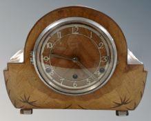 An Art Deco walnut 8 day mantel clock.