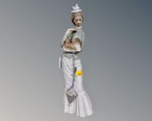 A Lladro figure, Walk with the Dog, No. 4893.