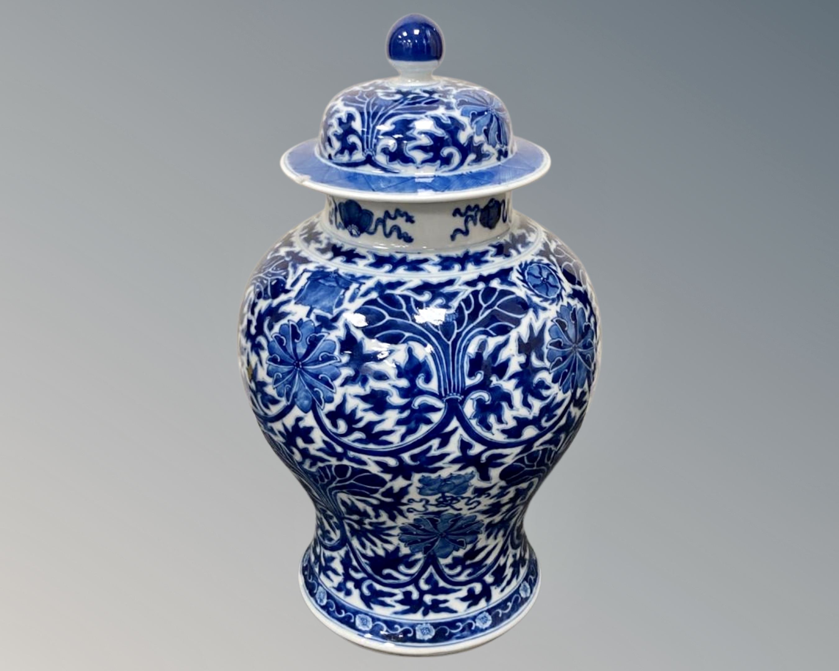 A Chinese blue and white lidded urn, height 43.5 cm, Kangxi six character mark to base.