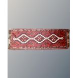 A Khamseh rug, South-West Iran, 128cm by 44cm.