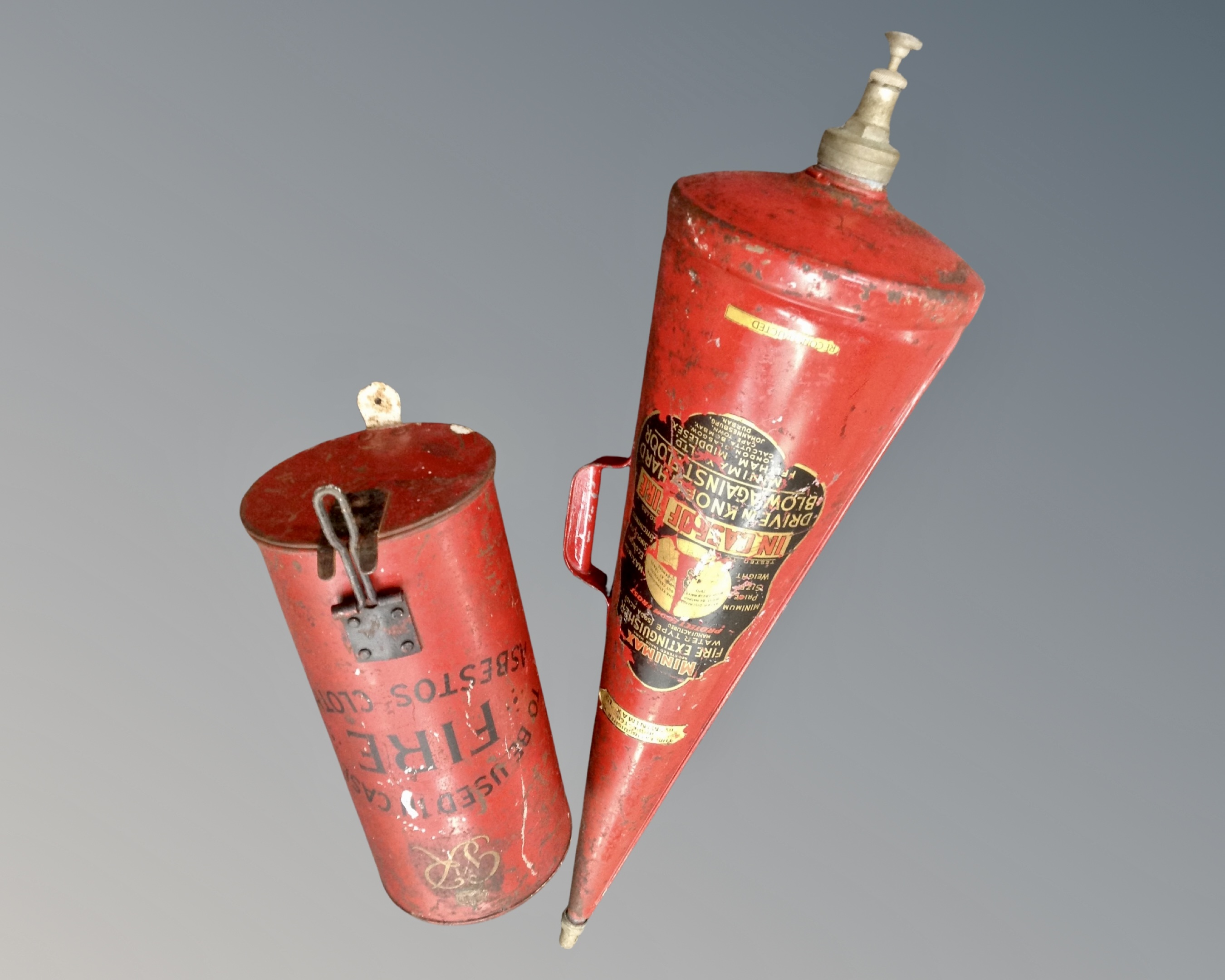 A Minimax fire extinguisher together with a George VI asbestos cloth holder.