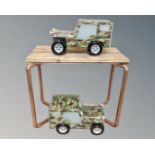 A pair of lights in the form of army jeeps together with a pine and copper pipe occasional table.