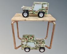 A pair of lights in the form of army jeeps together with a pine and copper pipe occasional table.