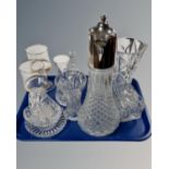 A tray containing crystal decanter with silver plated top, further glassware including vases,