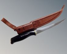 A Normark knife in leather sheath