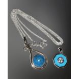 Two silver and turquoise-coloured stone pendants, one on silver chain.