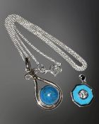 Two silver and turquoise-coloured stone pendants, one on silver chain.