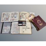 A box containing stamp albums of world stamps, a small quantity of coins, commemorative crown,