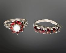 A silver opal and garnet cluster ring, together with a silver and garnet five-stone ring.