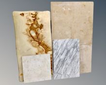 Four pieces of marble, onyx and granite.